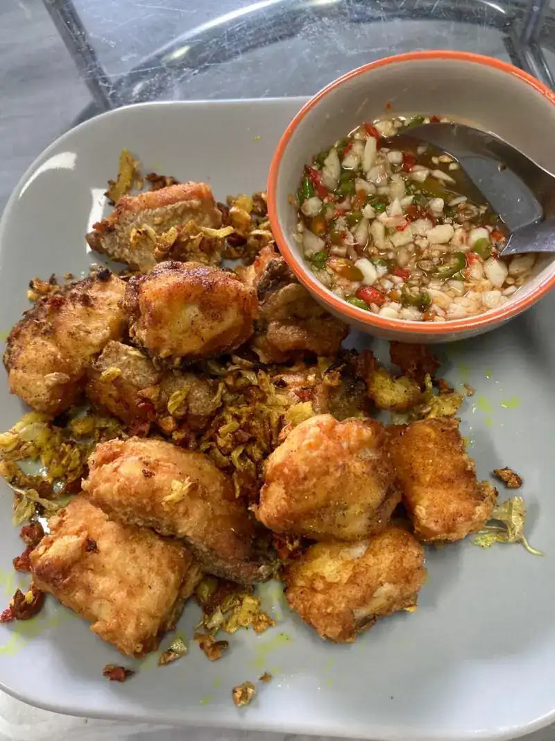 Golden fried pieces with crisp garlic and a chilli dip