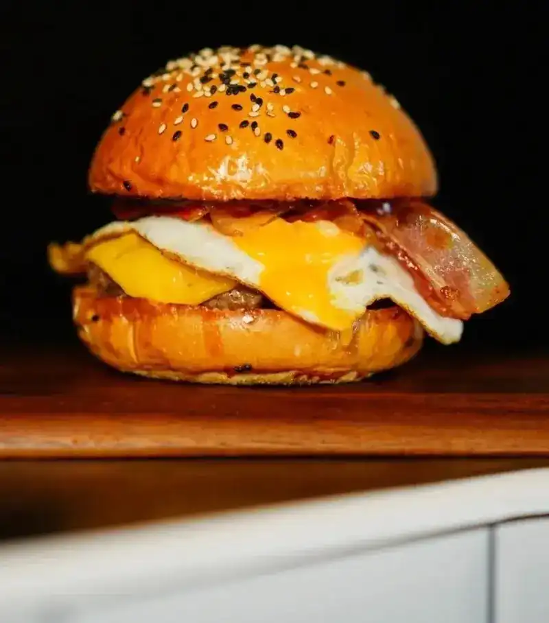 P. Escobar, the beef burger with bacon, fried egg and cheddar