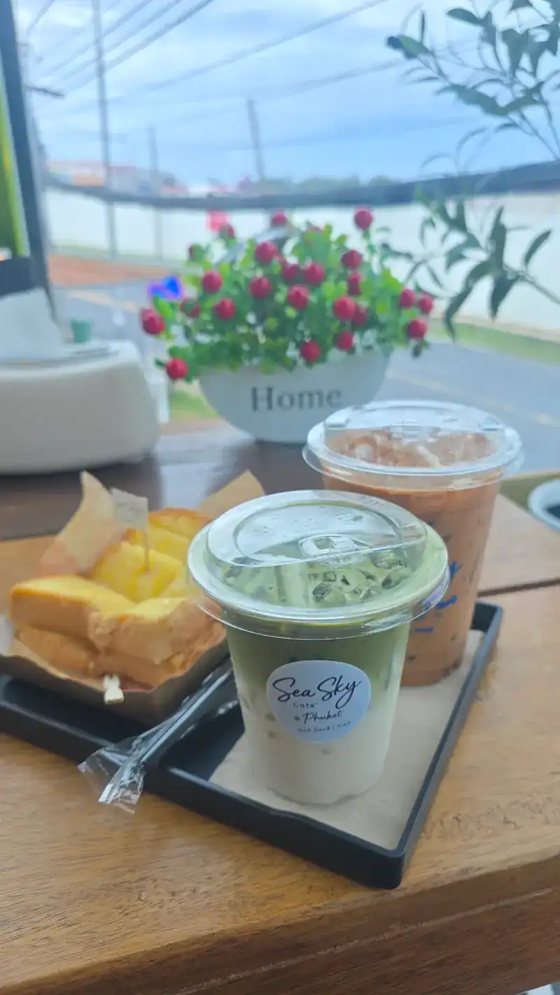 Toast and iced drinks at a window table