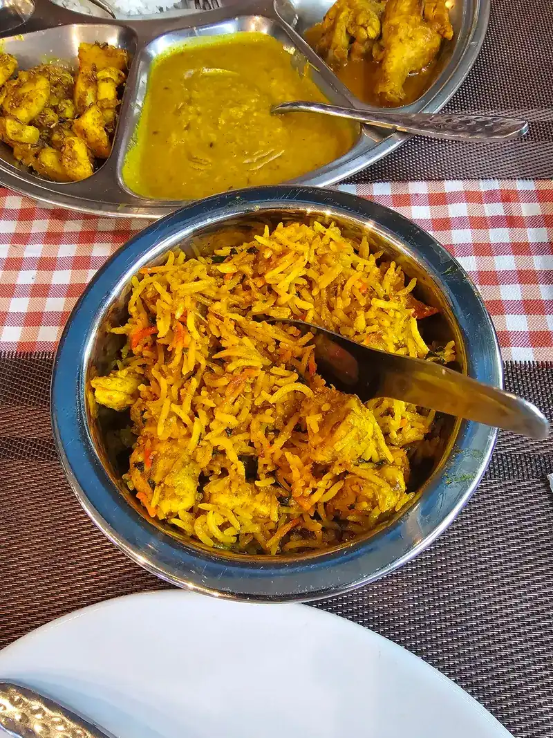 Spiced yellow rice in a steel bowl