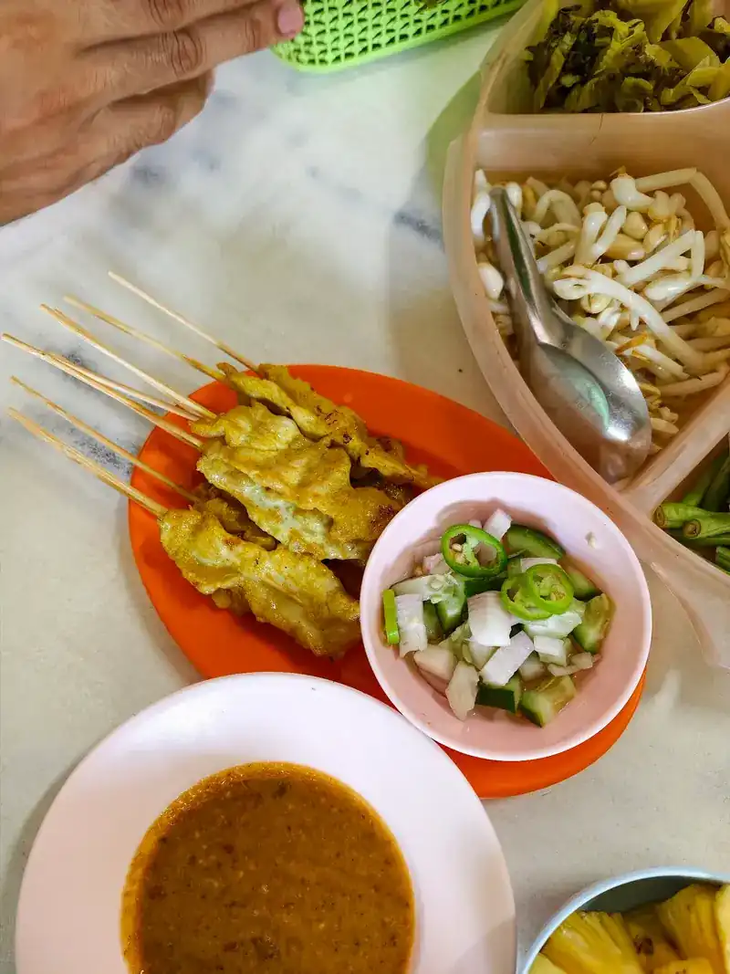 Pork satay with peanut sauce and cucumber relish