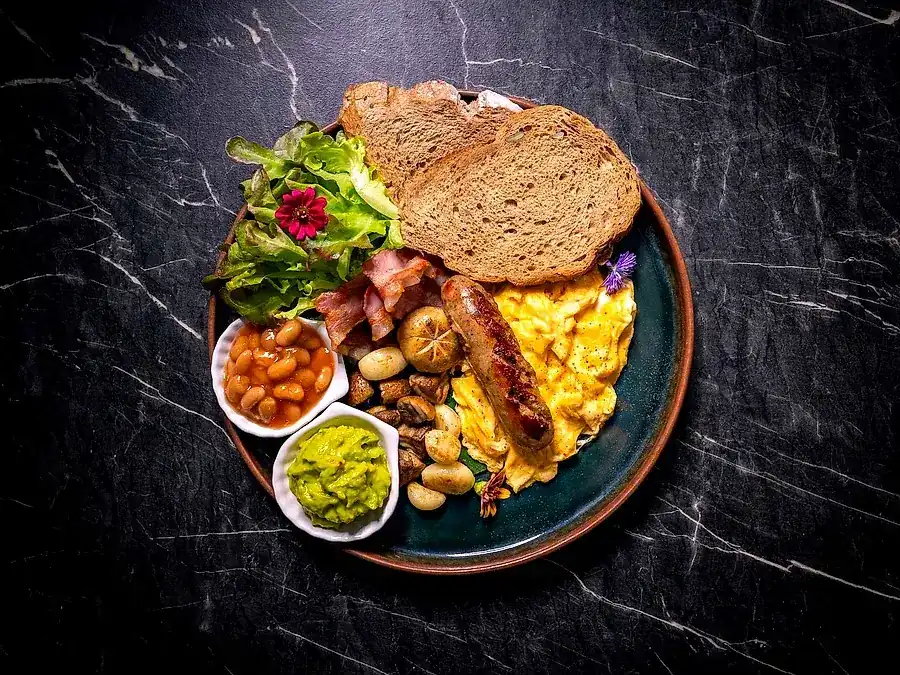 The Courtside Breakfast: sourdough, scrambled eggs, sausage, bacon, beans, mushrooms and avocado