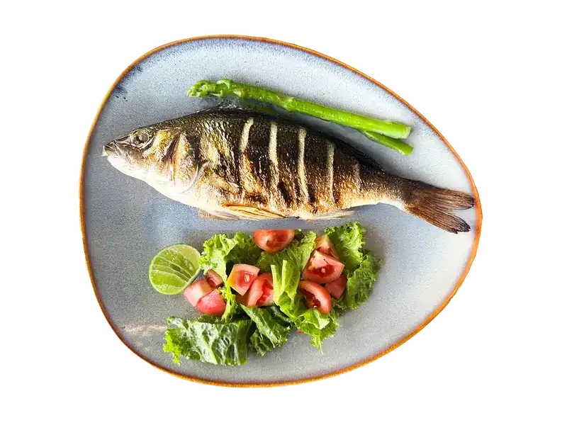 Whole grilled fish with salad