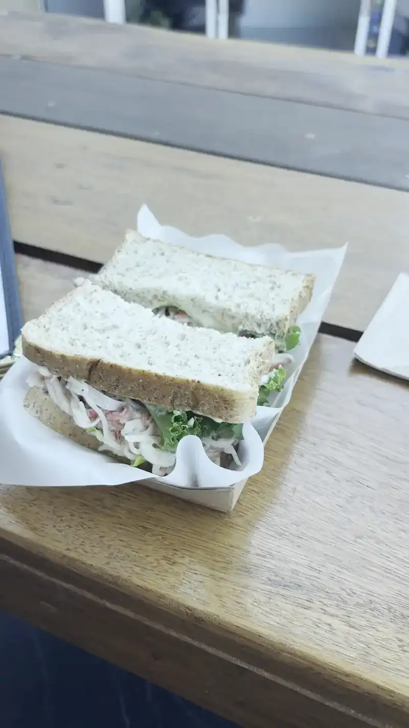 A sandwich in a paper tray