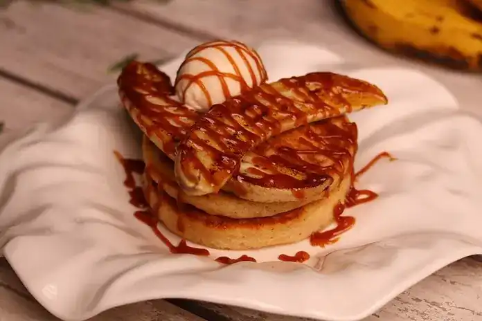 Pancakes with roasted banana, ice cream and caramel