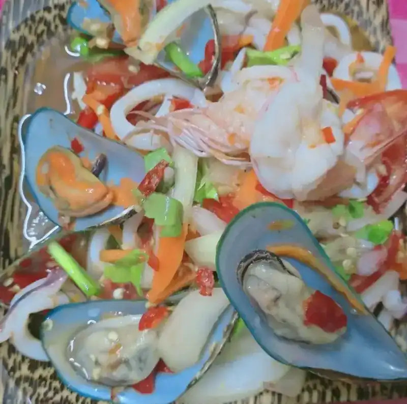 A spicy seafood salad with mussels, squid and prawns
