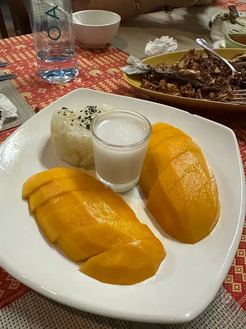 Mango with sticky rice and a small glass of coconut cream