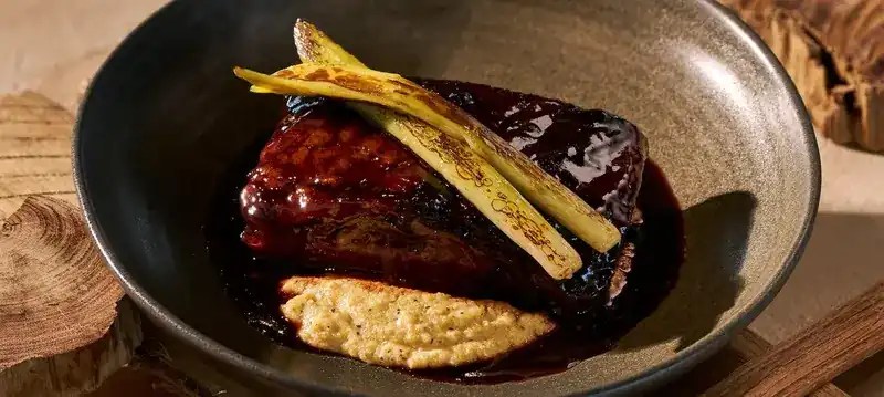 Glazed short rib with truffle polenta and grilled baby leeks