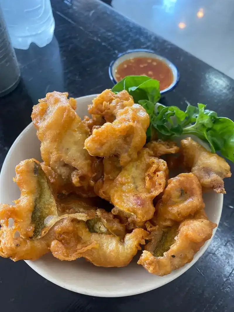 Deep-fried fish pieces with chilli dipping sauce