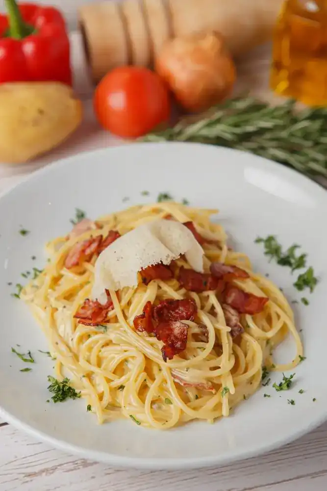 Spaghetti carbonara with crisp bacon and parmesan