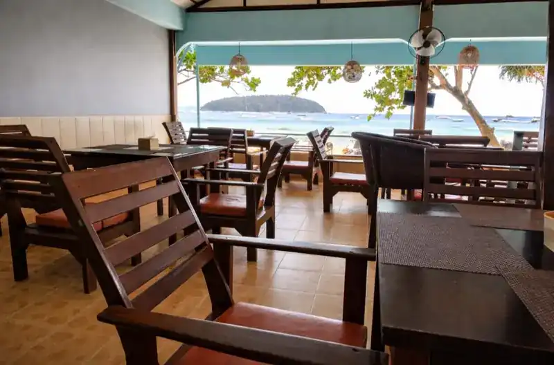 The open dining room looking out over the bay to an island