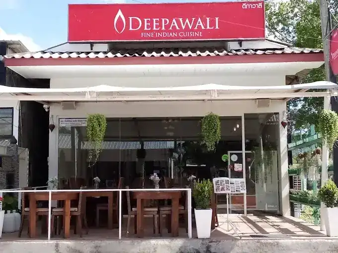 Deepawali's shopfront on Laguna Road: red sign, glass front and terrace tables