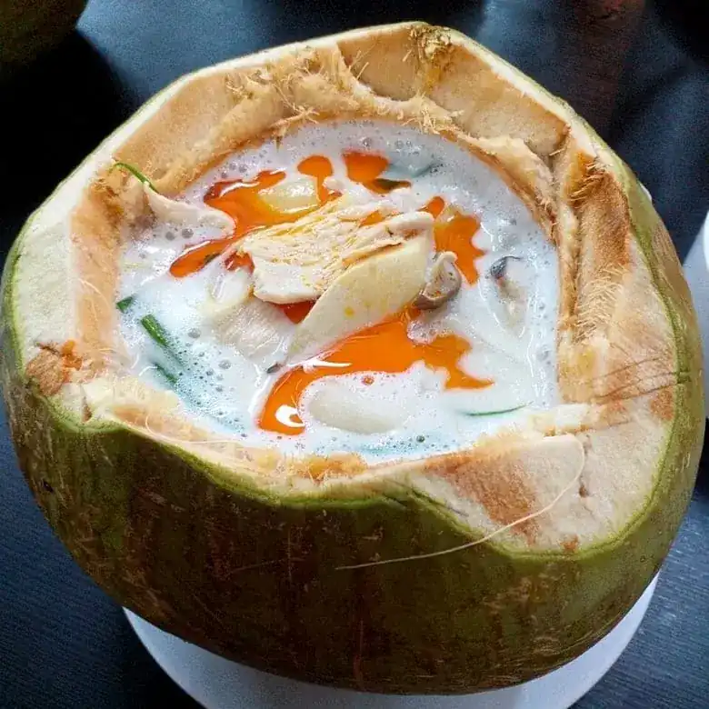 Tom Kha Gai served inside a young coconut