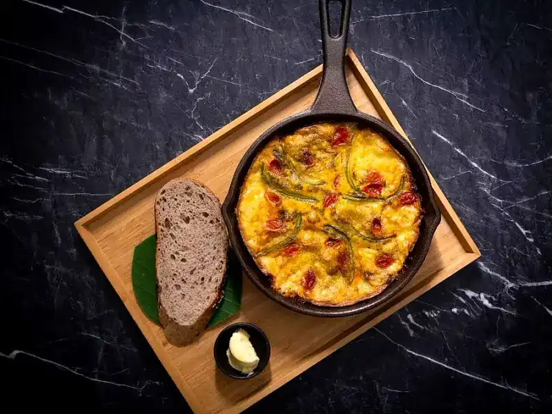 Breakfast Pan in a cast-iron skillet with sourdough and butter