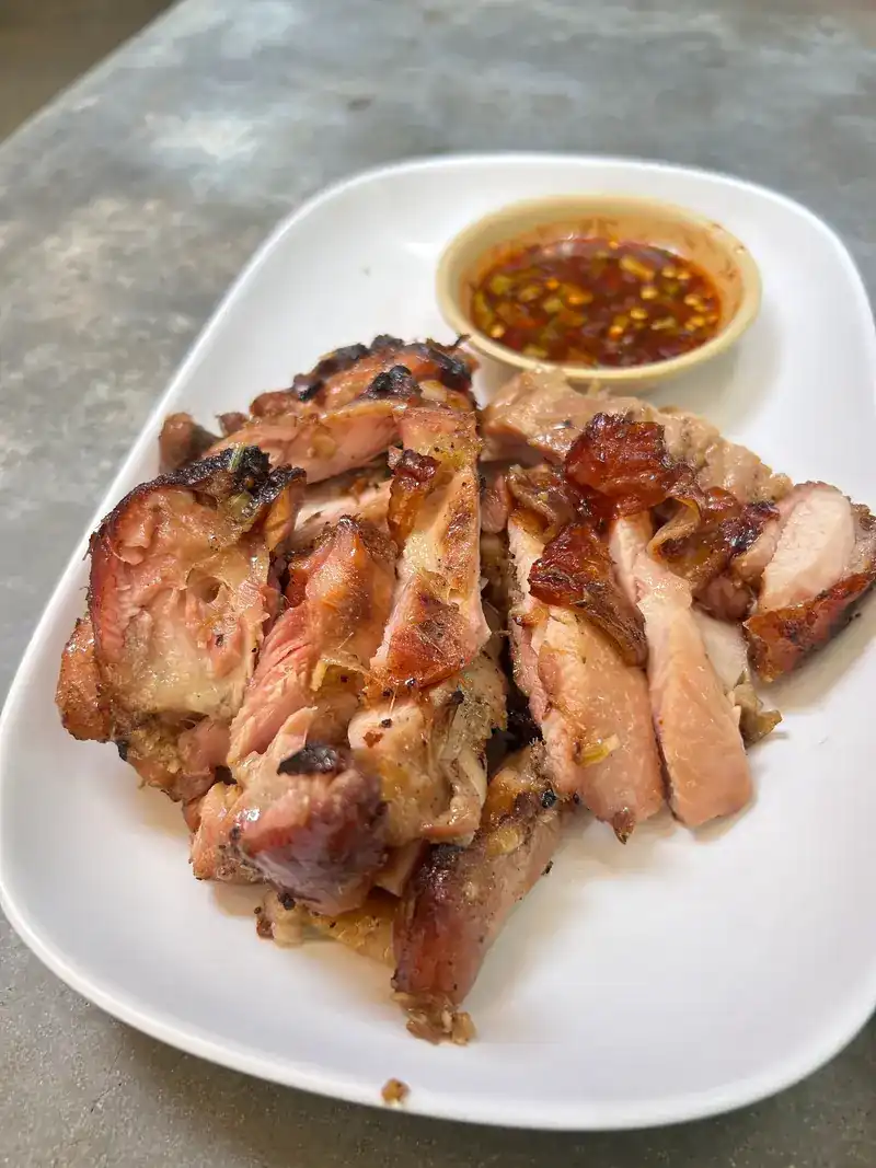 Sliced grilled meat with chilli dipping sauce