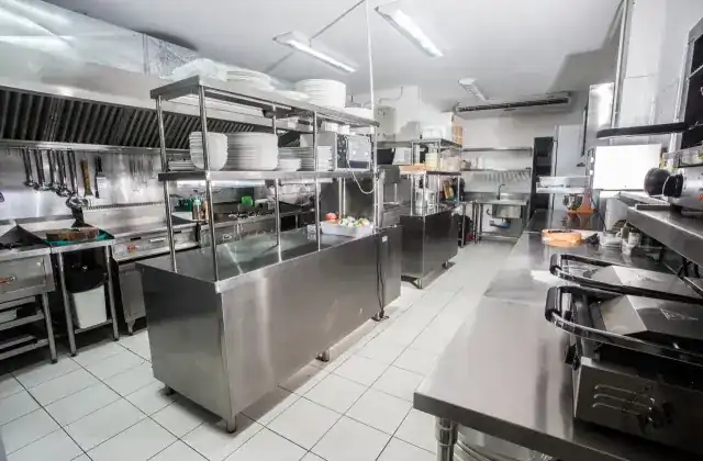 The Chez Nous kitchen, stainless steel and white tiles