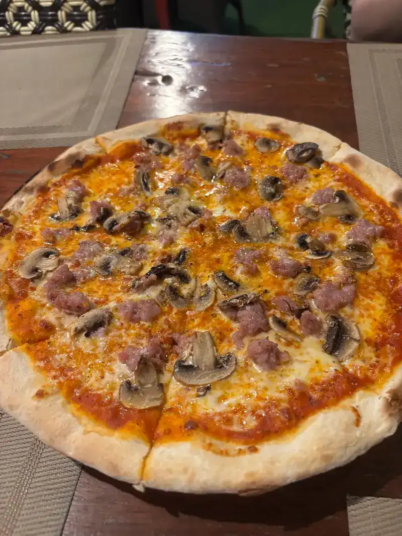 Pizza with mushrooms and sausage