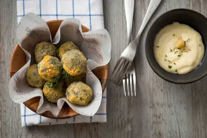 Golden croquettes with a creamy dip