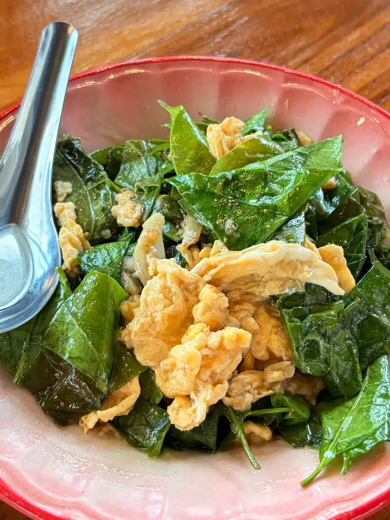 Dark green leaves stir-fried with egg