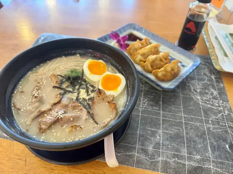 Tonkotsu ramen with egg and pork, gyoza on the side