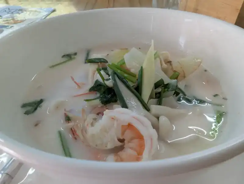 Coconut milk soup with prawn and herbs