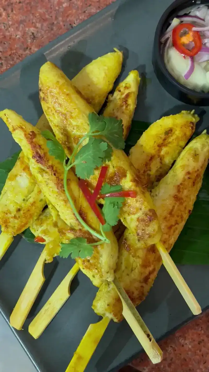 Chicken satay skewers with fresh coriander and chilli