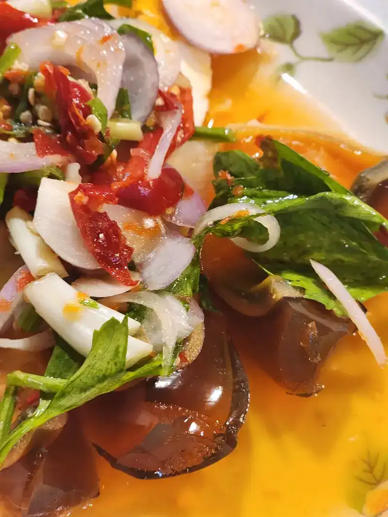 Preserved egg salad with shallots, chilli and fresh herbs