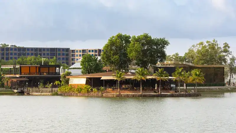 The restaurant on its island, seen across the lake by day