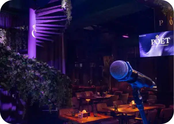A microphone on its stand in front of the dining room at Poët