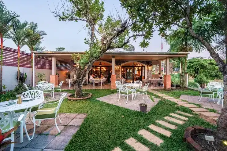 Garden tables on the lawn in front of the terrace