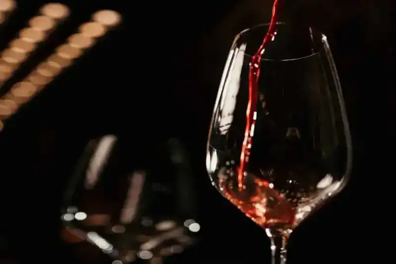 Red wine being poured into a glass