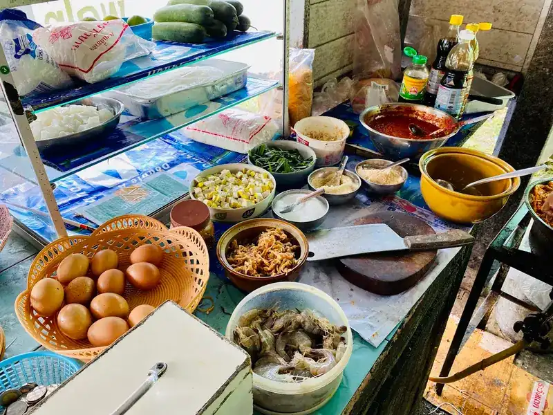 The pad thai counter: fresh shrimp, eggs, tofu, chives and noodles set out in bowls
