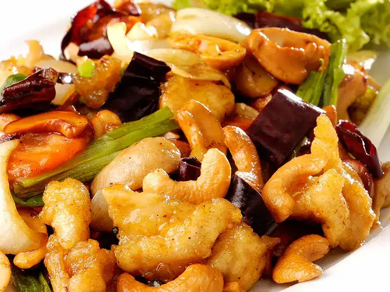 Stir-fried chicken with cashew nuts, dried chili and spring onion